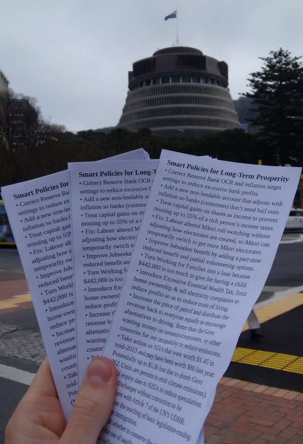 A photo of a handful of flyers fanned out with the Beehive in the background.